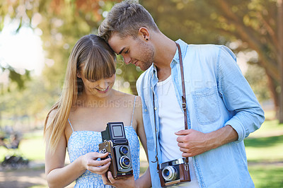 Buy stock photo Retro camera, nature or couple check results of vintage photography, photo memory or creative photoshoot. Antique equipment, tourist or nature photographer looking at garden picture for media project