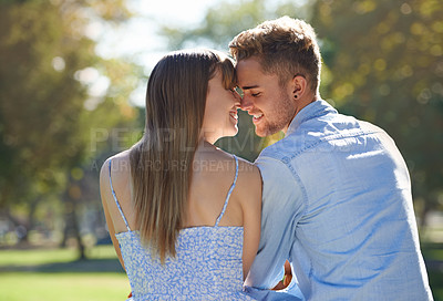 Buy stock photo Couple, nose touch and relax in park with happiness outdoor, love and commitment for healthy relationship. Romantic date in nature, eskimo kiss and people with smile together in public garden