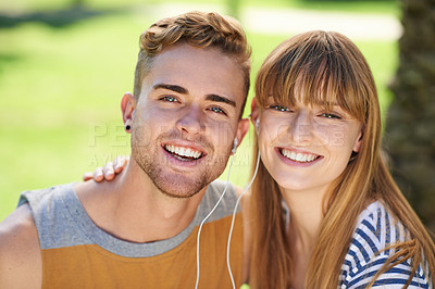 Buy stock photo Couple, portrait and listening to music with earphones in garden, park or relax in summer with technology. Happiness, man and woman hearing radio, audio and sound together outdoor with love and care