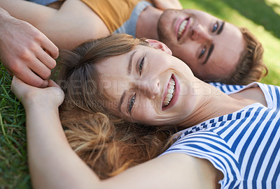 Buy stock photo Lawn, love and portrait of happy couple relax for summer sunshine, wellness or weekend break for outdoor leisure. Smile, care and face of boyfriend, girlfriend or people lying on grass pitch together