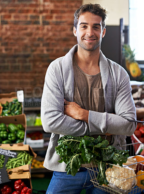 Buy stock photo Portrait, healthy food or happy man shopping in supermarket for grocery sale or discounts deal. Arms crossed, smile or customer buying fresh produce for diet nutrition, organic vegetables or spinach