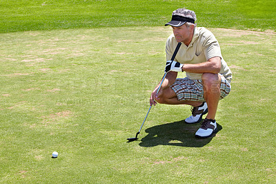 Buy stock photo Golf, thinking and green with a sports man outdoor, playing a game for recreation on grass during summer. Planning, fitness and sport with a mature male golfer or athlete on a course for a match