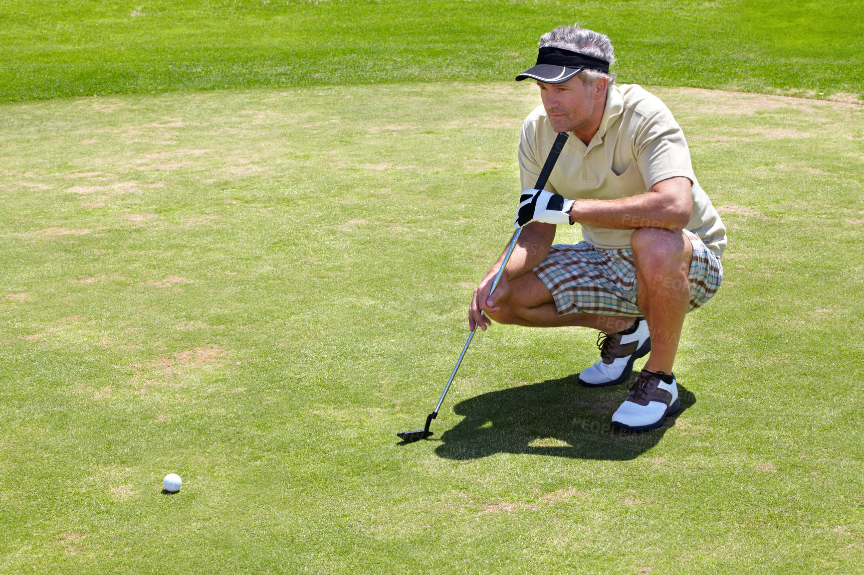 Buy stock photo Golf, thinking and green with a sports man outdoor, playing a game for recreation on grass during summer. Planning, fitness and sport with a mature male golfer or athlete on a course for a match