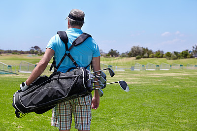 Buy stock photo Golf course, staff bag and rear view of senior man outdoors for training, sports and exercise routine. Behind, golfing and elderly male golfer at a park for retirement, hobby and sports practice
