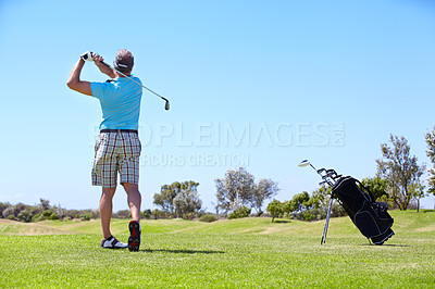 Buy stock photo Senior, man and playing golf on field, lawn or green grass for sports, swing or taking a shot on course. Rear view of person, golfer or player hitting ball, strike or goal to score point in nature