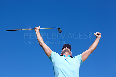 Buy stock photo Low-angle shot of a mature male golfer with his arms raised in celebration