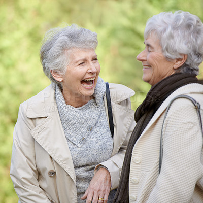 Buy stock photo Senior women, comic and laughing in nature for reunion, together and funny chat for trip in outdoor. Elderly friends, joke and silly discussion on travel vacation in england, care and social in park