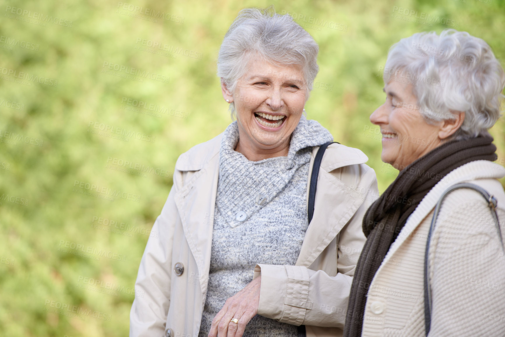Buy stock photo Senior friends, comic and laughing in nature for reunion, together and funny chat for trip in outdoor. Elderly women, joke and silly discussion on travel vacation in england, care and social in park