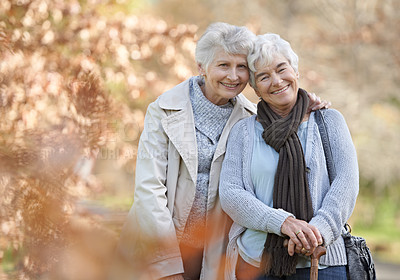 Buy stock photo Two senior women standing together and smiling