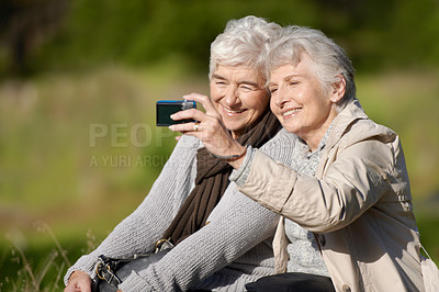 Buy stock photo Senior friends, outdoor and selfie for photography, picture and happy for memories in nature and elderly. Women, bonding and chatting with smile, funny and laughing together in retirement