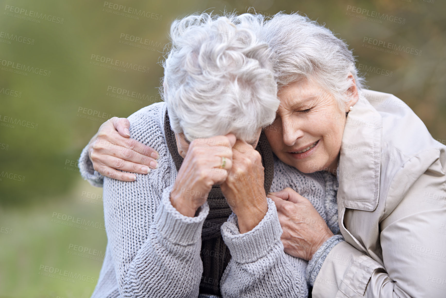 Buy stock photo Senior woman, empathy and crying in nature, depression and grief in outdoor environment. Elderly people, garden and comforting or consoling in park, sadness and friend hugging for care in retirement