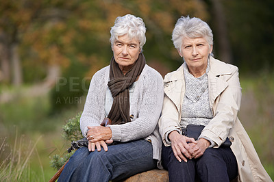 Buy stock photo Senior women, friends and portrait in nature, support and bonding together in outdoors. Elderly people, retirement and serious face in garden, park and relaxing on vacation or holiday to Netherlands