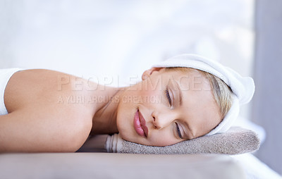 Buy stock photo Spa massage, relax and face of a woman on a bed for beauty, dermatology or skincare. Female client on a table with a towel and peace for luxury cosmetics, zen treatment or health and wellness
