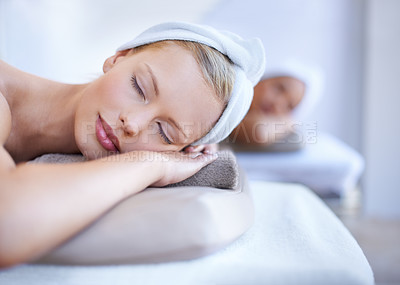 Buy stock photo Spa, woman and relax lying on table for skincare, beauty and luxury treatment for wellness. People, rest and face of calm person on bed in salon for massage or dermatology care with peace or zen