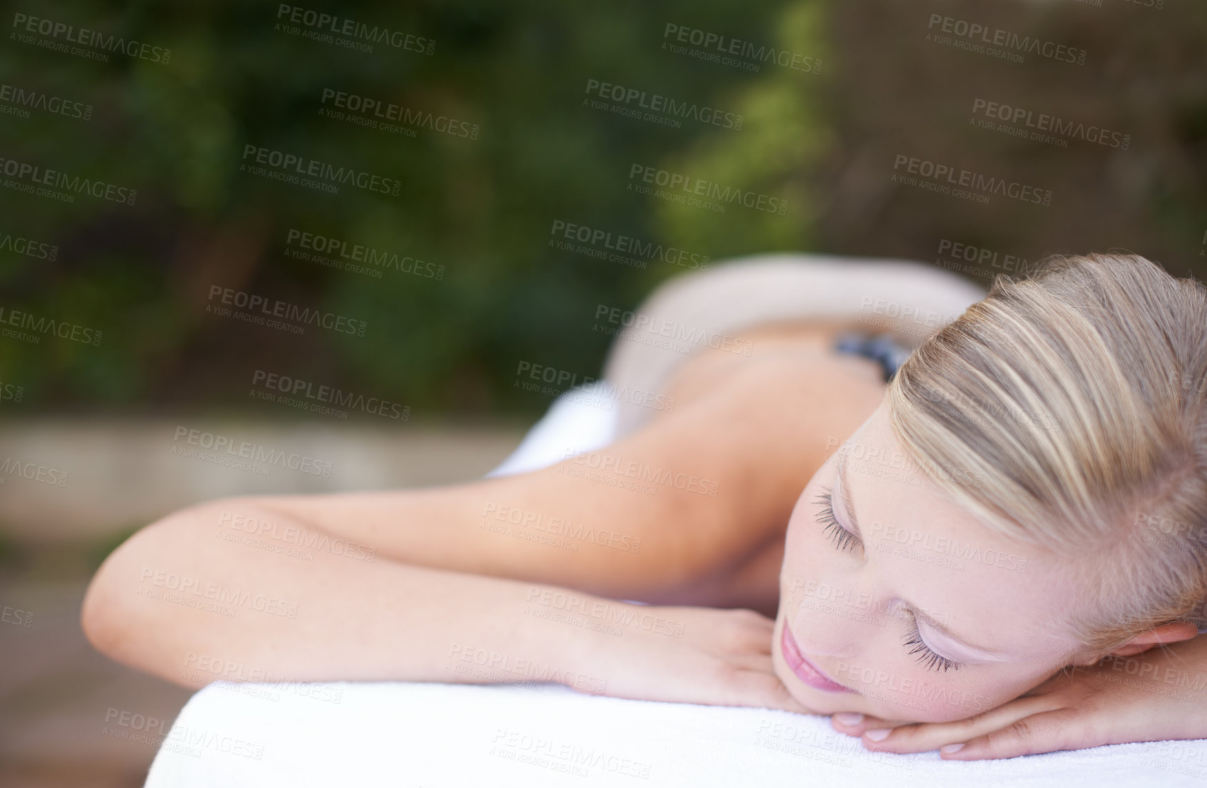 Buy stock photo Luxury, woman and sleeping on massage bed with comfort for wellness, mock up and beauty treatment or body care. Person, relax or physical therapy at resort, salon table and spa on holiday or vacation