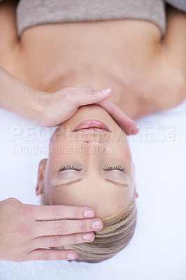 Buy stock photo Relax, reiki and facial massage, woman in spa for health, wellness and luxury treatment with eyes closed. Beauty salon, professional skin care therapist with hands on healthy face of girl from above.