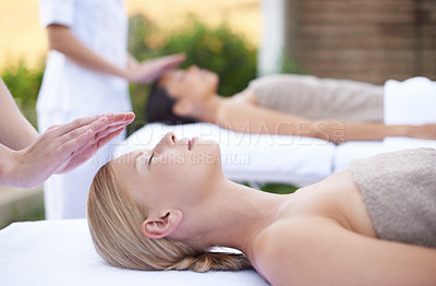 Buy stock photo Reiki, facial flow and women at spa for health, wellness and chakra energy healing with luxury stress relief treatment. Beauty salon, skin care and woman in holistic massage on face for calm aura.