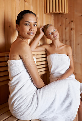 Buy stock photo Sauna, portrait and friends relax in spa for skincare, healthy detox or sweat for beauty wellness. Luxury, treatment and women sitting with towel in steam room for calm, skin care or benefits to body