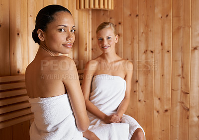 Buy stock photo Two young women in the sauna together