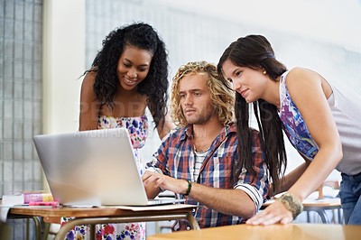 Buy stock photo Laptop, students and team learning in college, research or reading online together. Computer, education and happy friends in university for studying knowledge, information and people typing in class