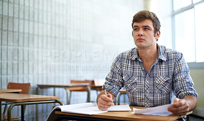 Buy stock photo Shot of a young college student studying in class
