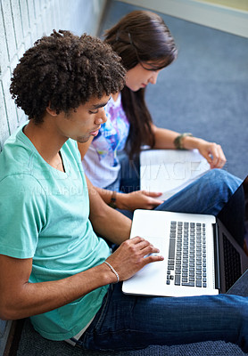 Buy stock photo Laptop, students and learning in university, research or reading online together. Computer, education and friends in college for studying knowledge, typing information or scholarship at school campus