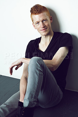 Buy stock photo Portrait, smile and man on the floor, fashion and stylish with confidence, carefree and relax. Face, male person or gentleman with casual outfit, style and trendy clothes with calm, chilling or peace