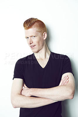 Buy stock photo An trendy redheaded man posing in front of a white background