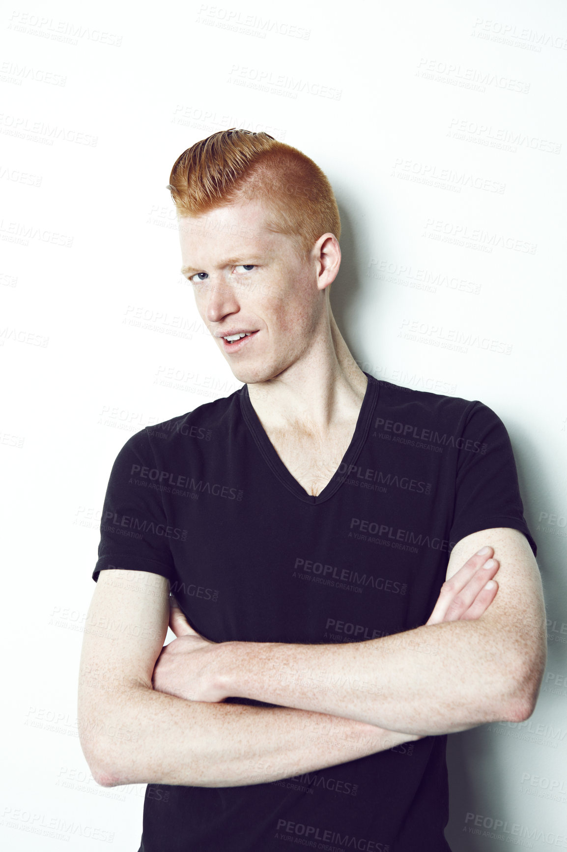 Buy stock photo An trendy redheaded man posing in front of a white background