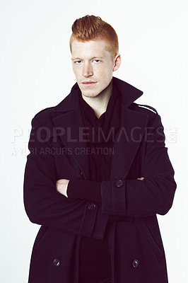 Buy stock photo A redheaded man wearing a black jacket standing in a studio and looking at the camera