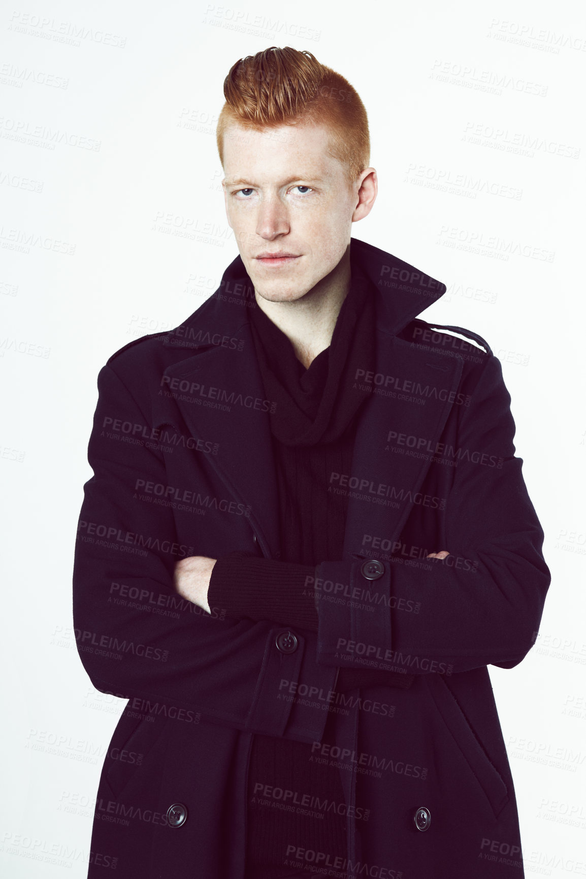 Buy stock photo A redheaded man wearing a black jacket standing in a studio and looking at the camera