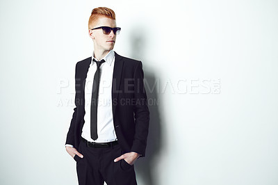 Buy stock photo Fashion, suit and mockup with a man in studio on a white background for formal or contemporary style. Thinking, sunglasses and confident with a handsome young male person standing hands in pockets