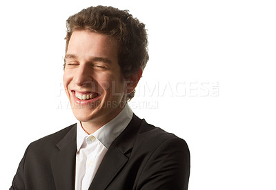 Buy stock photo A young man wearing a buttoned up shirt and jacket laughing as he stands against a white background