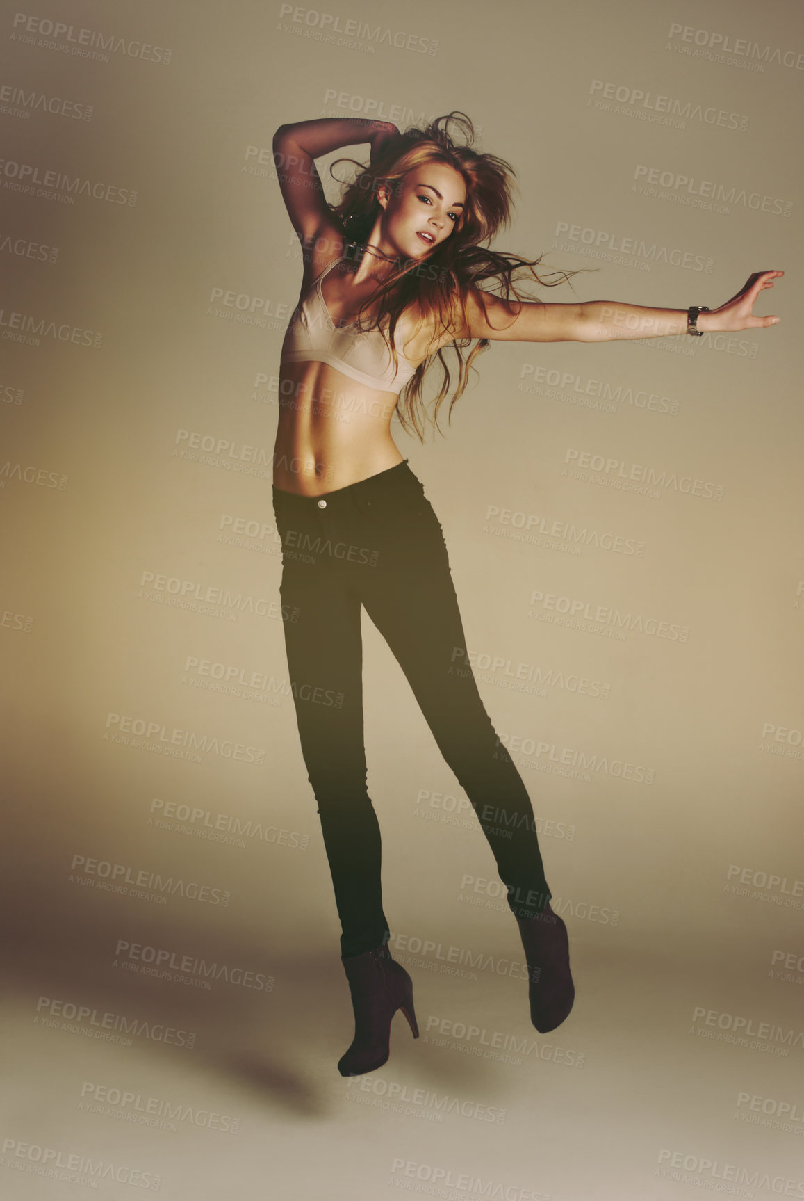 Buy stock photo Dance jump, woman and portrait of a young dancer model with casual fashion and confidence. Isolated, studio background and dancing pose of a female person with youth, body freedom and natural beauty