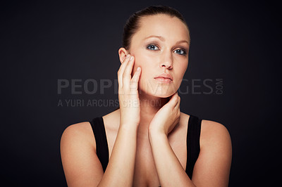 Buy stock photo Skincare, portrait and woman in studio for dermatology, shine or wellness treatment on black background. Cosmetic, beauty and female model with hands on face for glowing skin, detox or self care