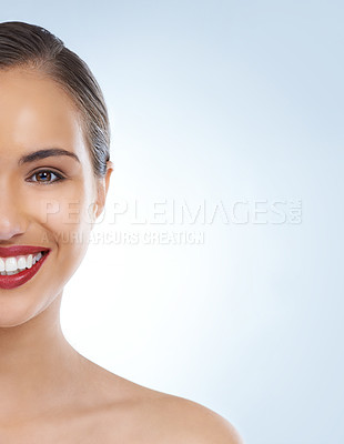 Buy stock photo Happy woman, portrait and face with red lipstick for makeup, beauty or cosmetics on a blue studio background. Young female person or model smile for facial treatment in cosmetology on mockup space