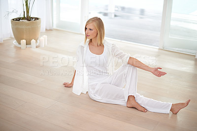 Buy stock photo Full length shot of a young blonde woman doing yoga