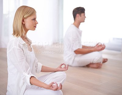 Buy stock photo Lotus hands, meditation and couple on a floor for peace, balance and spirituality in their home together. Relax, profile and people in a living room for zen, stress relief or holistic self care