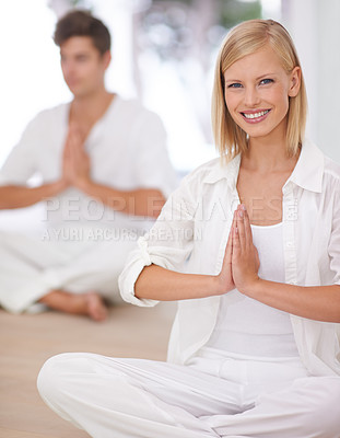 Buy stock photo Two people sitting cross legged and doing yoga together