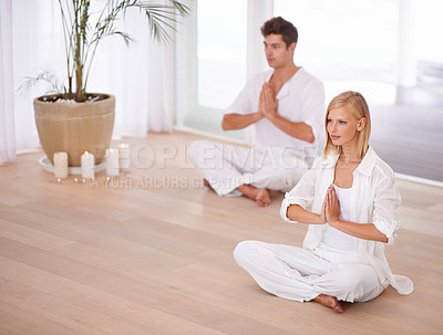 Buy stock photo Meditation, prayer and couple on floor for wellness, mindfulness and yogi training in home for calm. Mental health, peace and man and woman for yoga, holistic healing and zen energy in living room