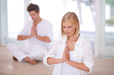 Buy stock photo Meditation, praying hands and people on a floor for peace, wellness and mental health, zen or balance. Mindfulness, relax and couple with holistic, breathing or energy exercise for spiritual healing