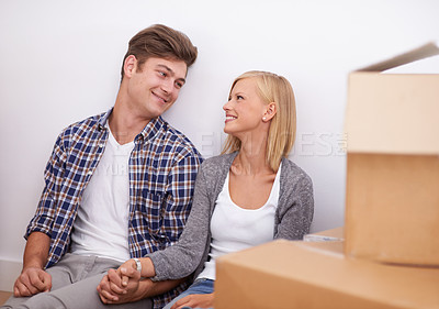 Buy stock photo Shot of a happy young couple on their moving-in day