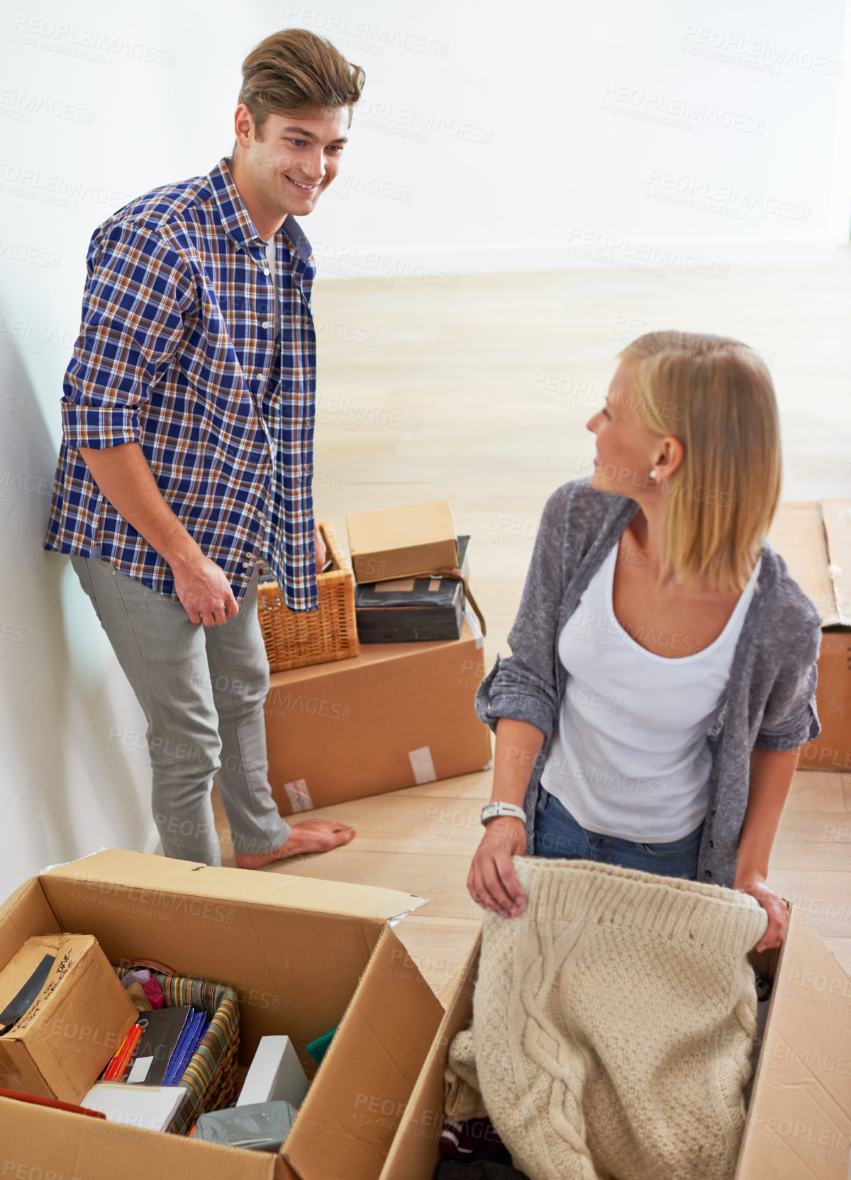 Buy stock photo Man, woman and packing boxes for moving to new home or property investment, real estate or mortgage. Couple, happy and apartment ownership or relocation organize for marriage beginning, buy or rent