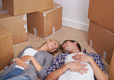 Buy stock photo Couple, floor and moving or boxes for new home packing or real estate property to relax in marriage and apartment. Man, woman and rest or investment loan or mortgage for relocation, rent or buy