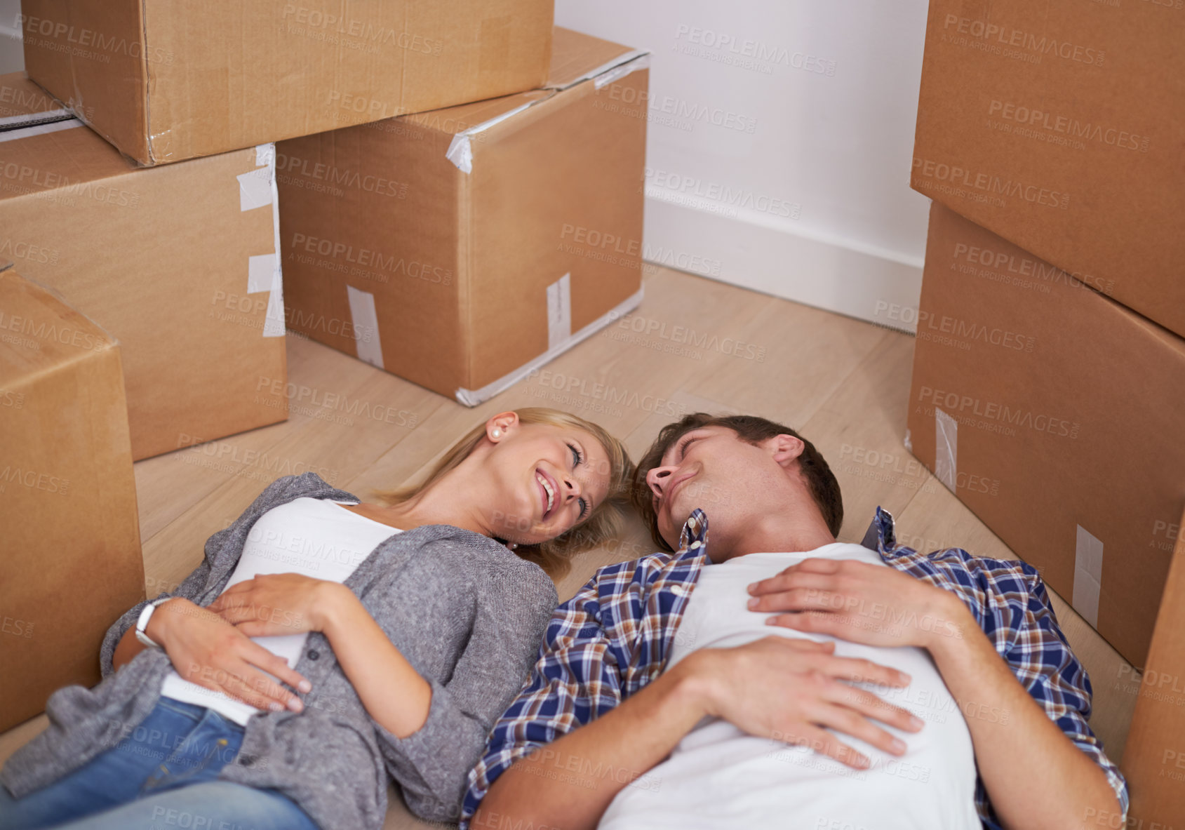 Buy stock photo Couple, floor and moving or boxes for new home packing or real estate property to relax in marriage and apartment. Man, woman and rest or investment loan or mortgage for relocation, rent or buy