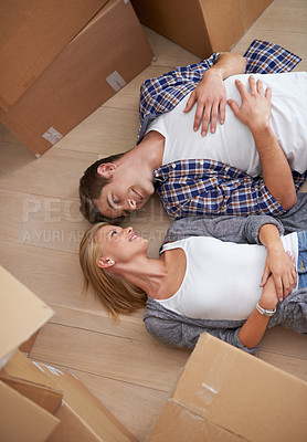 Buy stock photo Couple, floor and moving boxes or rest from packing or real estate property for bonding, marriage or apartment. Man, woman and relax for investment loan or mortgage for relocation, rent or new home