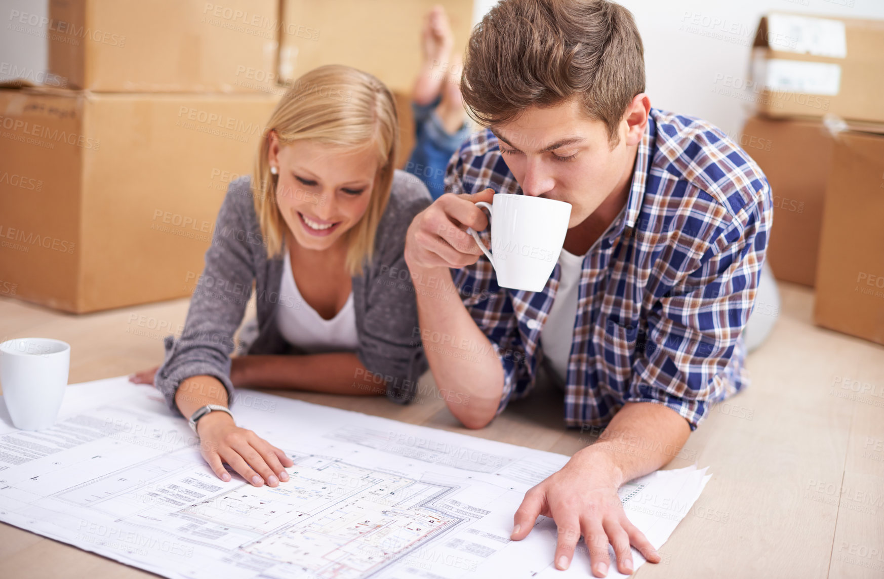 Buy stock photo Couple, floor plan and blueprints with moving boxes for renovation, new home or property investment. Man, woman and happy thinking or development for real estate design for mortgage, buy or coffee
