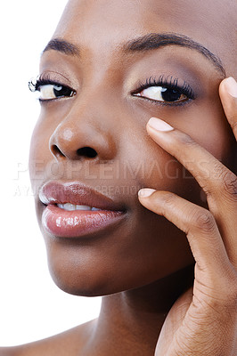 Buy stock photo Skincare, beauty and portrait of black woman on a white background for wellness, cosmetics and makeup. Dermatology, salon and person touch face with glow, aesthetic and confidence in studio
