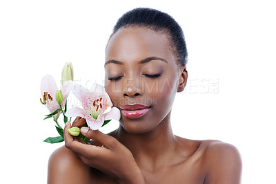 Buy stock photo Black woman, flower and natural beauty, dermatology and skincare for glow and wellness on white background. Nature, healthy skin and sustainable cosmetics, face with shine and orchid in a studio