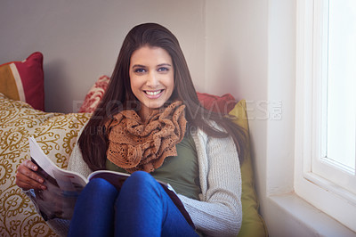 Buy stock photo Woman, portrait and reading magazine to relax at home, information and news for knowledge. Female person, relaxing and happy for announcement in publication, morning routine and story update on sofa
